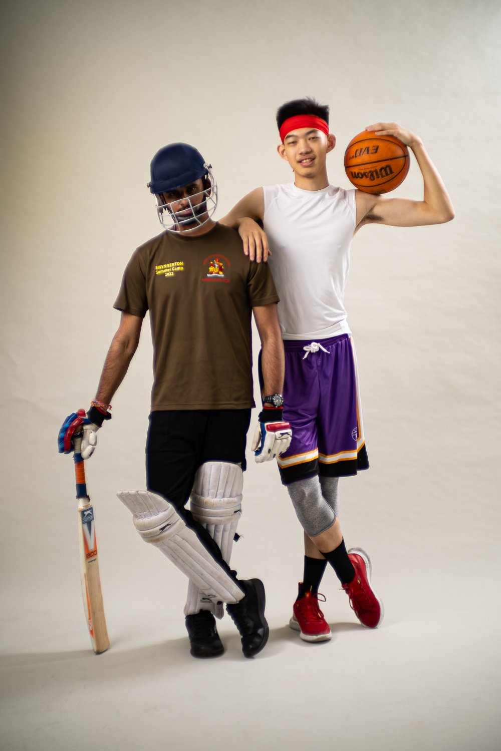 Kylin Shaw holding a basketball and wearing the Hippos knee sleeve, with co-founder Bhavy Metakar in cricket gear.